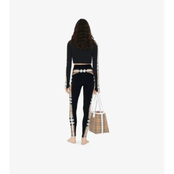 Bluză scurtă din jersey elastic cu fermoar și bordură în carouri Bluză scurtă din jersey elastic cu fermoar și bordură în carouri