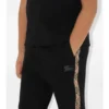 Pantaloni de jogging din bumbac cu bordură în carouri