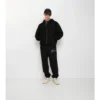 Pantaloni de jogging din bumbac cu logo cursiv în carouri