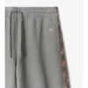 Pantaloni de trening din bumbac cu borduri în carouri Pantaloni de trening din bumbac cu borduri în carouri