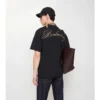 Tricou din bumbac cu logo cursiv în carouri Tricou din bumbac cu logo cursiv în carouri